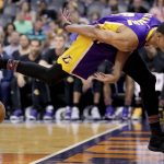 Los Angeles Lakers guard Jordan Clarkson (6) tries to save a lose ball against the Phoenix Suns during the first half of an NBA basketball game, Wednesday, Feb. 15, 2017, in Phoenix. (AP Photo/Matt York)