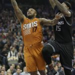Phoenix Suns forward P.J. Tucker, left, goes to the basket against Sacramento Kings forward DeMarcus Cousins during the first quarter of an NBA basketball game Friday, Feb. 3, 2017, in Sacramento, Calif. (AP Photo/Rich Pedroncelli)