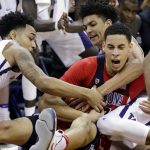 Arizona's Chance Comanche, right, fights for the ball with Washington's David Crisp, left, and Matisse Thybulle during the second half of an NCAA college basketball game Saturday, Feb. 18, 2017, in Seattle. Arizona won 76-68. (AP Photo/Elaine Thompson)