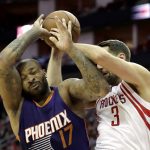 Houston Rockets' Ryan Anderson (3) is fouled by Phoenix Suns' P.J. Tucker (17) during the first half of an NBA basketball game, Saturday, Feb. 11, 2017, in Houston. (AP Photo/David J. Phillip)