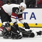 Los Angeles Kings defenseman Drew Doughty, bottom, dives in front of the shot of Arizona Coyotes center Martin Hanzal, of the Czech Republic, during the first period of an NHL hockey game, Thursday, Feb. 16, 2017, in Los Angeles. (AP Photo/Mark J. Terrill)