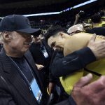 Nike co-founder Phil Knight, left, celebrates with Oregon's Dillon Brooks and fellow Duck fans after Oregon defeated Arizona in an NCAA college basketball game Saturday, Feb. 4, 2017, in Eugene, Ore. (AP Photo/Chris Pietsch)