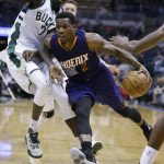 Phoenix Suns' Eric Bledsoe (2) drives against the Milwaukee Bucks' Thon Maker (7) during the second half of an NBA basketball game, Sunday, Feb. 26, 2017, in Milwaukee. (AP Photo/Jeffrey Phelps)