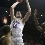 Arizona center Dusan Ristic (14) shoots against Southern California during the second half of an NCAA college basketball game, Thursday, Feb. 23, 2017, in Tucson, Ariz. Arizona defeated Southern California 90-77. (AP Photo/Rick Scuteri)