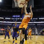 Phoenix Suns guard Devin Booker (1) goes to the basket in front of New Orleans Pelicans guard New Orleans Pelicans forward Dante Cunningham in the first half of an NBA basketball game in New Orleans, Monday, Feb. 6, 2017. (AP Photo/Gerald Herbert)