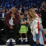 Jay Z, his wife Beyonce and their child sit court side before the NBA All-Star basketball game in New Orleans, Sunday, Feb. 19, 2017. (AP Photo/Gerald Herbert)