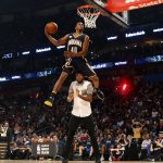 Indiana pacers Glenn Robinson III slam dunks over teammate Paul George as he participates in the slam dunk contest during NBA All-Star Saturday Night events in New Orleans, Saturday, Feb. 18, 2017. (AP Photo/Gerald Herbert)