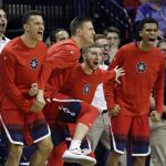 Players on the Arizona bench cheer a dunk against Washington late in the second half of an NCAA college basketball game Saturday, Feb. 18, 2017, in Seattle. Arizona won 76-68. (AP Photo/Elaine Thompson)