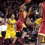 USC guard De'Anthony Melton (22) passes as Arizona State guard Tra Holder (0) looks on during the first half of an NCAA college basketball game, Sunday, Feb. 26, 2017, in Tempe, Ariz. (AP Photo/Matt York)