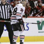 Chicago Blackhawks left wing Ryan Hartman (38) reacts after scoring a goal in the first period during an NHL hockey game against the Arizona Coyotes, Thursday, Feb. 2, 2017, in Glendale, Ariz. (AP Photo/Rick Scuteri)