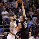 Los Angeles Clippers forward Blake Griffin (32) shoots over Phoenix Suns center Tyson Chandler (4) during the second half of an NBA basketball game, Wednesday, Feb. 1, 2017, in Phoenix. (AP Photo/Matt York)