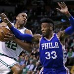 Boston Celtics center Al Horford (42) is blocked by Philadelphia 76ers forward Robert Covington (33) on a drive to the basket during the first quarter of an NBA basketball game in Boston, Wednesday, Feb. 15, 2017. (AP Photo/Charles Krupa)