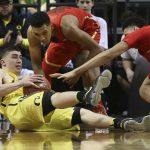 Oregon's Payton Pritchard, left, tries for a pass play from the floor under pressure from Arizona's Allonzo Trier, center, and Chance Comanche, right, during the second half of an NCAA college basketball game Saturday, Feb. 4, 2017, in Eugene, Ore. (AP Photo/Chris Pietsch)