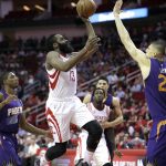 Houston Rockets' James Harden (13) shoots as Phoenix Suns' Alex Len, right, defends during the first half of an NBA basketball game, Saturday, Feb. 11, 2017, in Houston. (AP Photo/David J. Phillip)