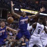 Phoenix Suns forward P.J. Tucker (17) loses control of the ball while shooting against Memphis Grizzlies forward James Ennis (8), and center Marc Gasol, right, in the first half of an NBA basketball game Wednesday, Feb. 8, 2017, in Memphis, Tenn. Suns guard Devin Booker (1) watches the play. (AP Photo/Brandon Dill)