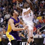 Phoenix Suns guard Eric Bledsoe (2) shoots over Los Angeles Lakers forward Larry Nance Jr. during the second half of an NBA basketball game, Wednesday, Feb. 15, 2017, in Phoenix. (AP Photo/Matt York)