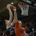 Arizona's Dusan Ristic, left, has his shot contested by Oregon State's Drew Eubanks (12) during the first half of an NCAA college basketball game in Corvallis, Ore., Thursday, Feb. 2, 2017. (AP Photo/Timothy J. Gonzalez)