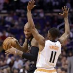 Los Angeles Clippers center Marreese Speights spins on Phoenix Suns guard Brandon Knight (11) during the first half of an NBA basketball game, Wednesday, Feb. 1, 2017, in Phoenix. (AP Photo/Matt York)