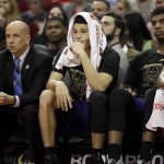 Phoenix Suns' Devin Booker watches from the bench during the second half of an NBA basketball game against the Houston Rockets, Saturday, Feb. 11, 2017, in Houston. (AP Photo/David J. Phillip)