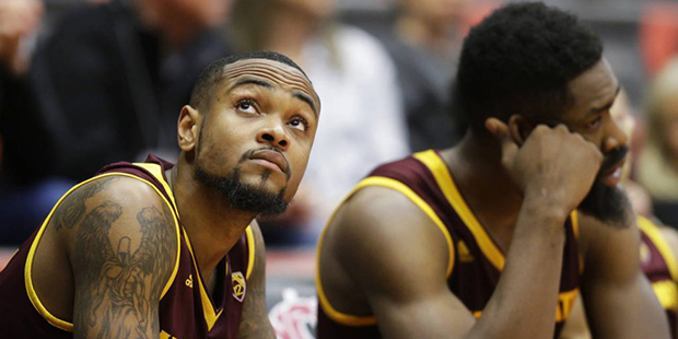 Arizona State guard Torian Graham, left, and forward Obinna Oleka, right, sit on the bench late in ...