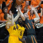 Arizona State's Kodi Justice (44) and Obinna Oleka (5) fight Oregon State's Drew Eubanks (12) for a rebound during the first half of an NCAA college basketball game in Corvallis, Ore., Saturday, Feb. 4, 2017. (AP Photo/Timothy J. Gonzalez)