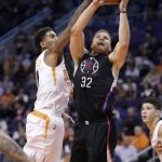 Los Angeles Clippers forward Blake Griffin (32) drives past Phoenix Suns forward Marquese Chriss during the first half of an NBA basketball game, Wednesday, Feb. 1, 2017, in Phoenix. (AP Photo/Matt York)