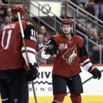 Arizona Coyotes defenseman Oliver Ekman-Larsson (23) celebrates with Martin Hanzal in the second period during an NHL hockey game against the Chicago Blackhawks, Thursday, Feb. 2, 2017, in Glendale, Ariz. (AP Photo/Rick Scuteri)