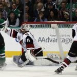 Arizona Coyotes goalie Louis Domingue is unable to stop the shot by Dallas Stars' Devin Shore as Dallas Stars' Esa Lindell (23) and Kevin Connauton (44) are near during the first period of an NHL hockey game, Friday, Feb. 24, 2017, in Dallas. (AP Photo/Mike Stone)
