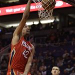 New Orleans Pelicans center Alexis Ajinca (42) dunks against the Phoenix Suns in the first quarter during an NBA basketball game, Monday, Feb. 13, 2017, in Phoenix. (AP Photo/Rick Scuteri)