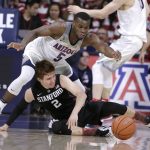 Arizona guard Kadeem Allen (5) and Stanford guard Robert Cartwright watch the ball get away during the second half of an NCAA college basketball game, Wednesday, Feb. 8, 2017, in Tucson, Ariz. Arizona defeated Stanford 74-67. (AP Photo/Rick Scuteri)