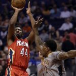 New Orleans Pelicans forward Solomon Hill (44) shoots over Phoenix Suns guard Eric Bledsoe in the first quarter during an NBA basketball game, Monday, Feb. 13, 2017, in Phoenix. (AP Photo/Rick Scuteri)