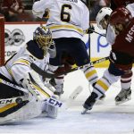 Buffalo Sabres goalie Anders Nilsson (31) makes the save on Arizona Coyotes left wing Jamie McGinn in the third period during an NHL hockey game, Sunday, Feb. 26, 2017, in Glendale, Ariz. Arizona defeated Buffalo 3-2. (AP Photo/Rick Scuteri)