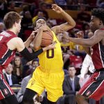 Arizona State guard Tra Holder (0) is fouled by Stanford guard Robert Cartwright as guard Marcus Allen, right, defends during the second half of an NCAA college basketball game, Saturday, Feb. 11, 2017, in Tempe, Ariz. (AP Photo/Matt York)