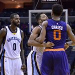 Memphis Grizzlies guard Andrew Harrison, center, gets between Phoenix Suns forward Marquese Chriss (0) and Grizzlies forward JaMychal Green, left, during an altercation on the court in the second half of an NBA basketball game Wednesday, Feb. 8, 2017, in Memphis, Tenn. (AP Photo/Brandon Dill)