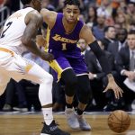 Los Angeles Lakers guard D'Angelo Russell (1) drives against Phoenix Suns guard Eric Bledsoe (2) during the first half of an NBA basketball game, Wednesday, Feb. 15, 2017, in Phoenix. (AP Photo/Matt York)
