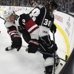 Arizona Coyotes center Christian Dvorak, left, and Los Angeles Kings defenseman Paul LaDue tangle during the first period of an NHL hockey game, Thursday, Feb. 16, 2017, in Los Angeles. (AP Photo/Mark J. Terrill)