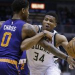 Milwaukee Bucks' Giannis Antetokounmpo (34) drives against the Phoenix Suns' Marquese Chriss during the first half of an NBA basketball game, Sunday, Feb. 26, 2017, in Milwaukee. (AP Photo/Jeffrey Phelps)