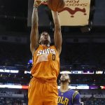 Phoenix Suns forward Marquese Chriss (0) slam dunk over New Orleans Pelicans forward Anthony Davis (23) in the first half of an NBA basketball game in New Orleans, Monday, Feb. 6, 2017. (AP Photo/Gerald Herbert)
