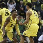 Oregon's Dylan Ennis, left, and Tyler Dorsey celebrate after the Ducks take the lead early over Arizona during the first half an NCAA college basketball game Saturday, Feb. 4, 2017, in Eugene, Ore. (AP Photo/Chris Pietsch)