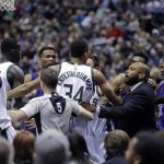 Players from the Milwaukee Bucks and Phoenix Suns have to be separated after a shoving match during the first half of an NBA basketball game Sunday, Feb. 26, 2017, in Milwaukee. (AP Photo/Jeffrey Phelps)