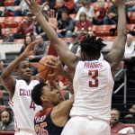 Arizona forward Allonzo Trier (35) tries to shoot between Washington State defenders Viont'e Daniels (4) and Robert Franks (3) in the first half of an NCAA college basketball game, Thursday, Feb. 16, 2017, in Pullman, Wash. (AP Photo/Kai Eiselein)