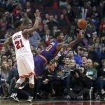 Phoenix Suns' Marquese Chriss (0) shoots after being fouled by Chicago Bulls' Jimmy Butler during the first half of an NBA basketball game Friday, Feb. 24, 2017, in Chicago. (AP Photo/Charles Rex Arbogast)