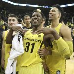 Oregon's Payton Pritchard, left, Dylan Ennis and Dillon Brooks celebrate after Oregon defeated Arizona 85-58 in an NCAA college basketball game Saturday, Feb. 4, 2017, in Eugene, Ore. (AP Photo/Chris Pietsch)