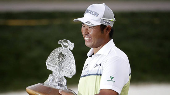 Hideki Matsuyama holds the champion's trophy after the Waste Management Phoenix Open golf tournamen...