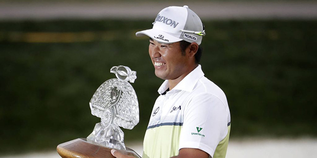 Hideki Matsuyama holds the champion's trophy after the Waste Management Phoenix Open golf tournamen...