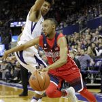 Arizona's Parker Jackson-Cartwright, right, drives past Washington's Matisse Thybulle during the first half of an NCAA college basketball game Saturday, Feb. 18, 2017, in Seattle. (AP Photo/Elaine Thompson)