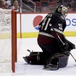 Arizona Coyotes goalie Mike Smith cannot stop a goal by San Jose Sharks defenseman Brent Burns during the first period of an NHL hockey game in Glendale, Ariz., Saturday, Feb. 18, 2017. (AP Photo/Chris Carlson)