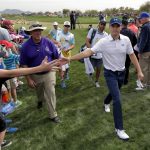 Jordan Spieth greets fans while walking to the fourth tee during the second round of the Phoenix Open golf tournament, Friday, Feb. 3, 2017, in Scottsdale, Ariz. (AP Photo/Matt York)