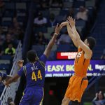 Phoenix Suns guard Devin Booker (1) shoots over New Orleans Pelicans forward Solomon Hill (44) in the first half of an NBA basketball game in New Orleans, Monday, Feb. 6, 2017. (AP Photo/Gerald Herbert)