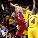 Stanford guard Robert Cartwright (2) and Arizona State guard Tra Holder (0) battle for the ball during the second half of an NCAA college basketball game, Saturday, Feb. 11, 2017, in Tempe, Ariz. (AP Photo/Matt York)